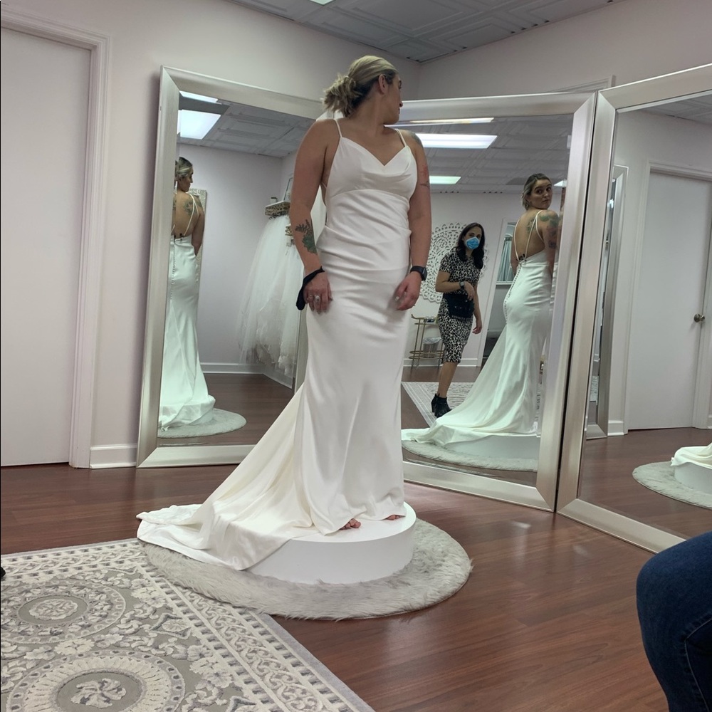 New with tags, never worn wedding dress.
